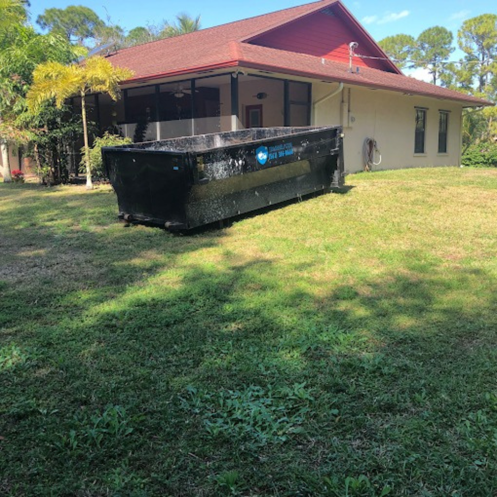 residential dumpster rental placed outside of someone's home in orlando, fl